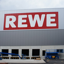 Industriehallen Fassadenbeschriftung REWE Fassadenbeschriftung