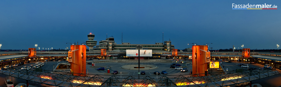 fassadenmalerei am flughafen tegel für sixt beleuchtete betontürme